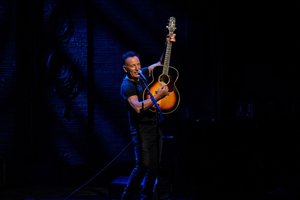 Bruce Springsteen playing on stage